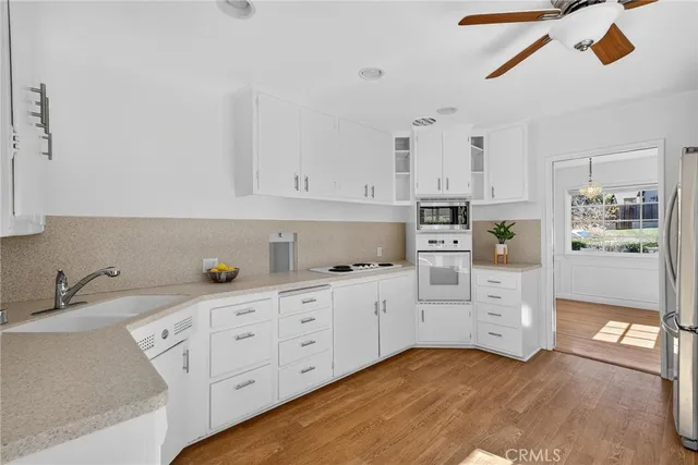 a kitchen with cabinets and window
