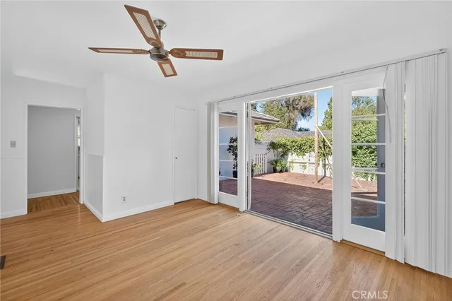 a view of livingroom with hardwood floor and a ceiling fan