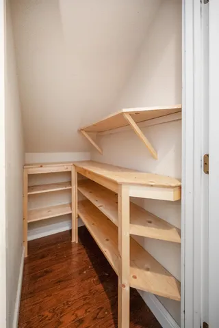 a bathroom with a double vanity sink toilet mirror and shower