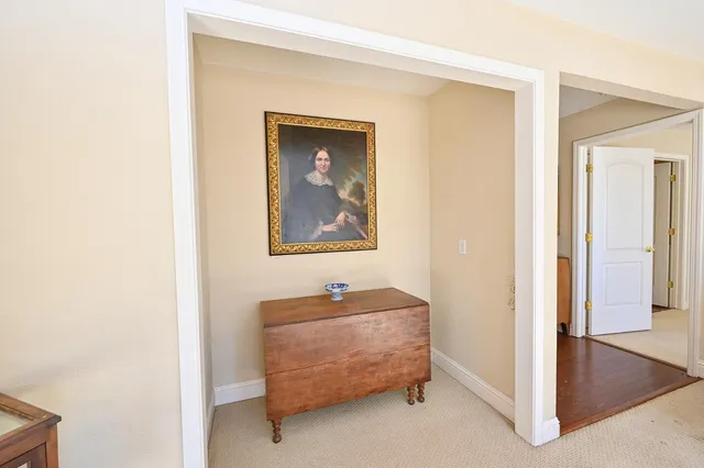 a dining room with furniture a chandelier and window