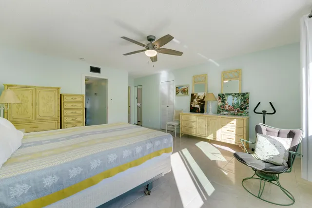 a bedroom with a bed and gym equipment