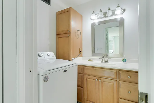 a bathroom with a sink and mirror