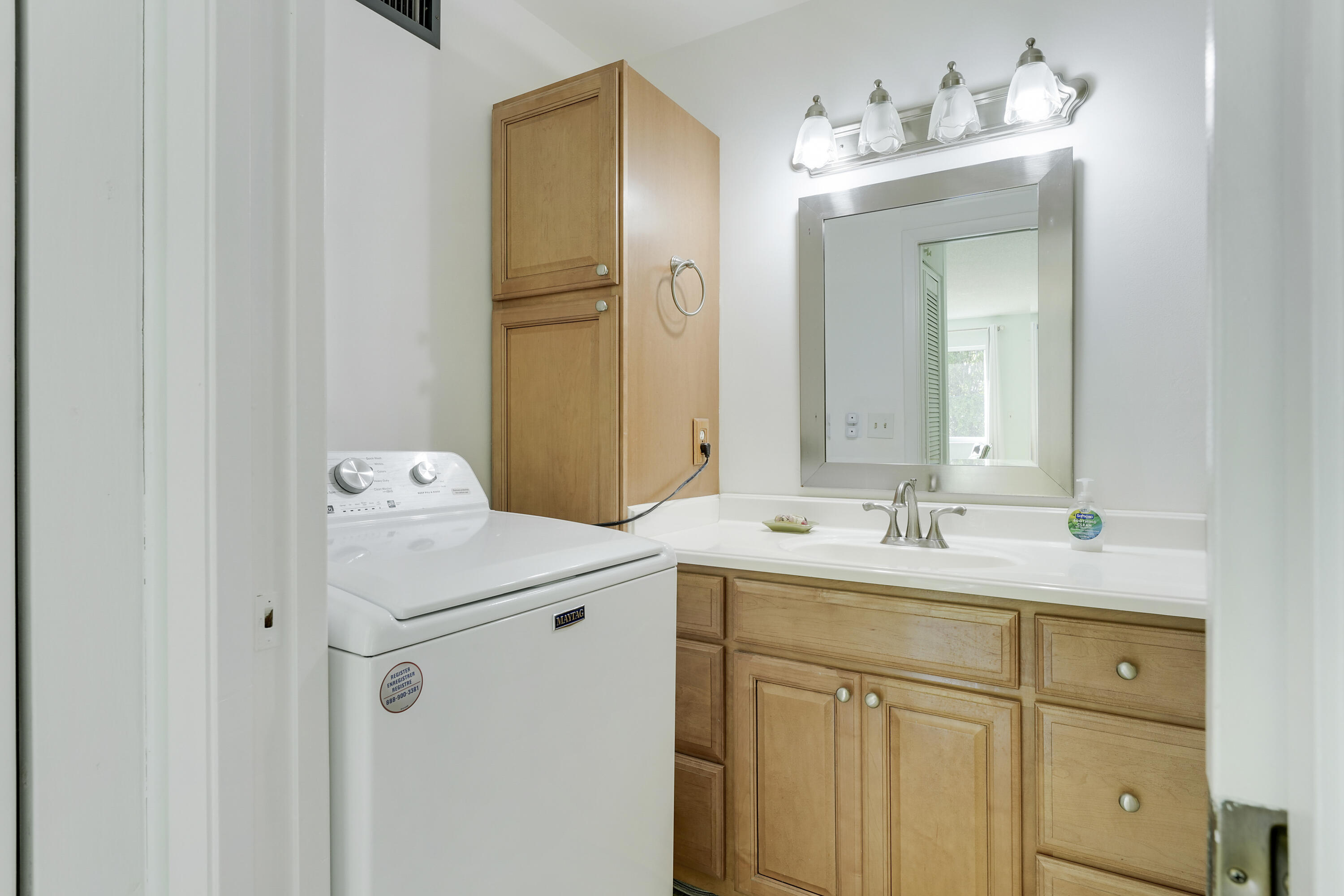 4515 Northwest 3rd Court, Unit C Delray Beach, FL 33445 - Photo 19 of 25 a bathroom with a sink and mirror