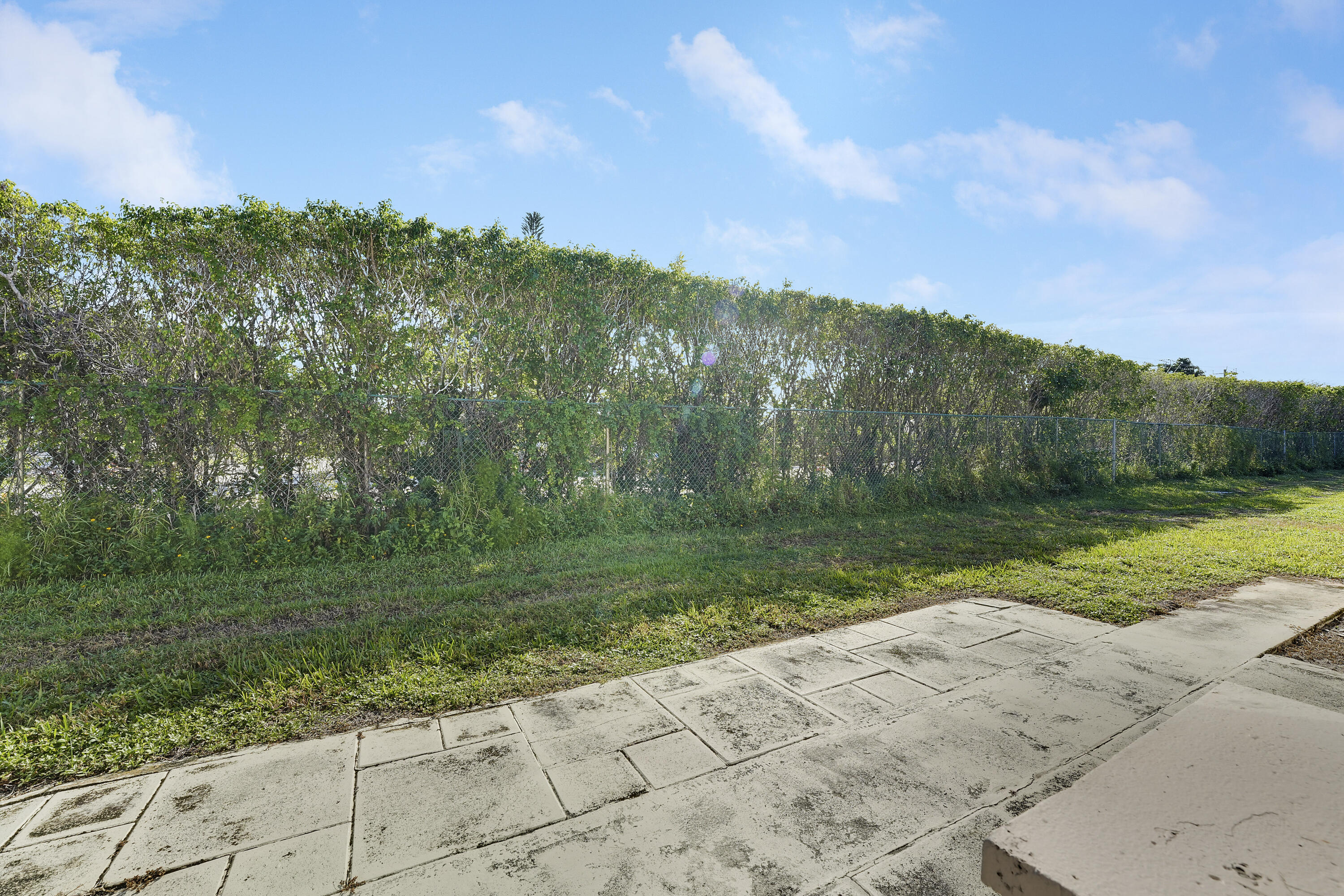 4515 Northwest 3rd Court, Unit C Delray Beach, FL 33445 - Photo 20 of 25 a view of a park with large trees