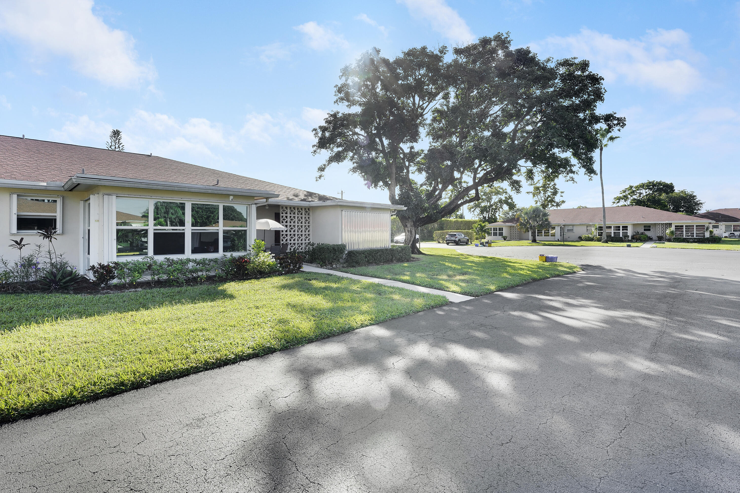 4515 Northwest 3rd Court, Unit C Delray Beach, FL 33445 - Photo 2 of 25 a view of a house with a backyard