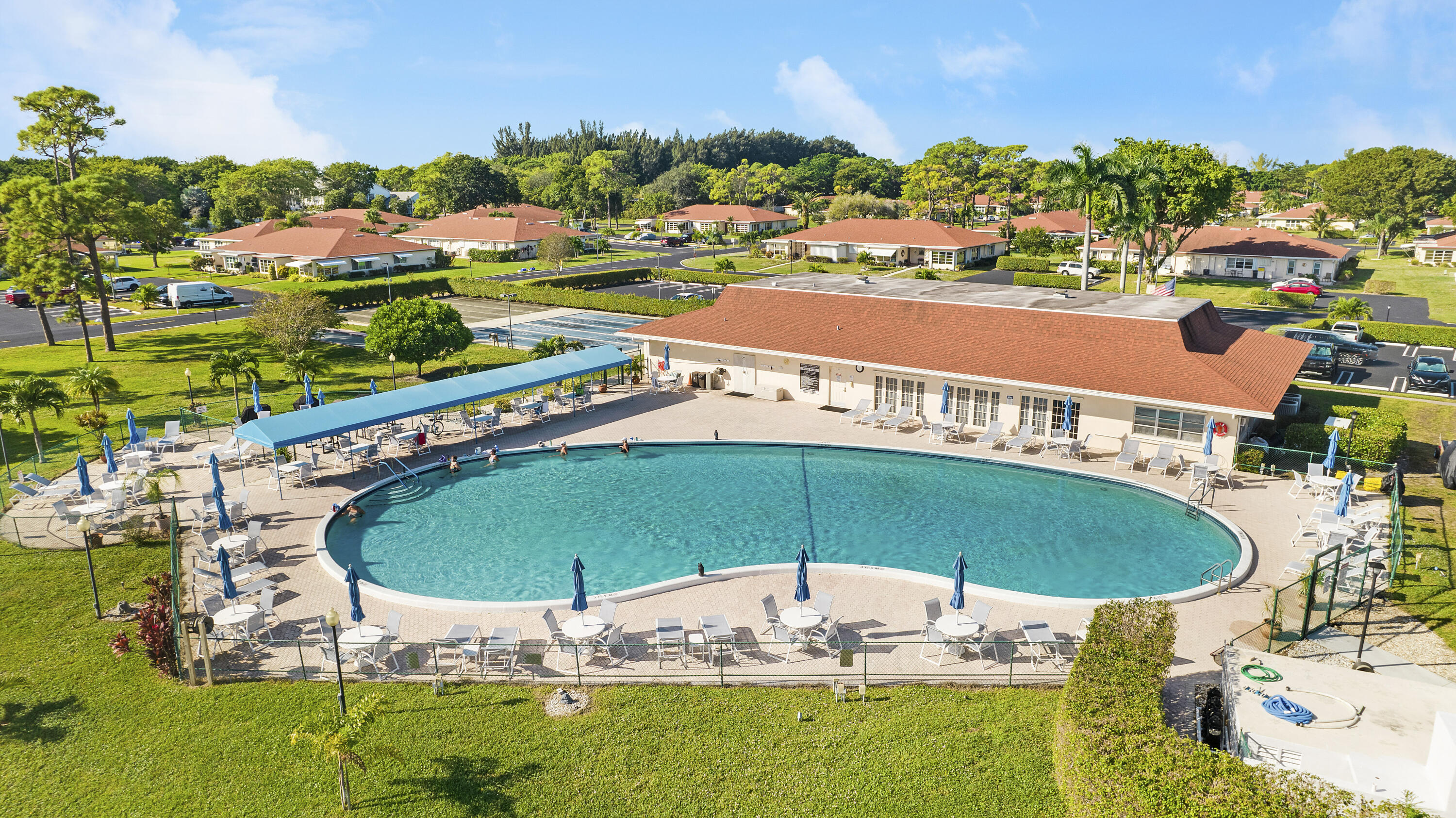 4515 Northwest 3rd Court, Unit C Delray Beach, FL 33445 - Photo 22 of 25 an outdoor space with pool and outdoor seating
