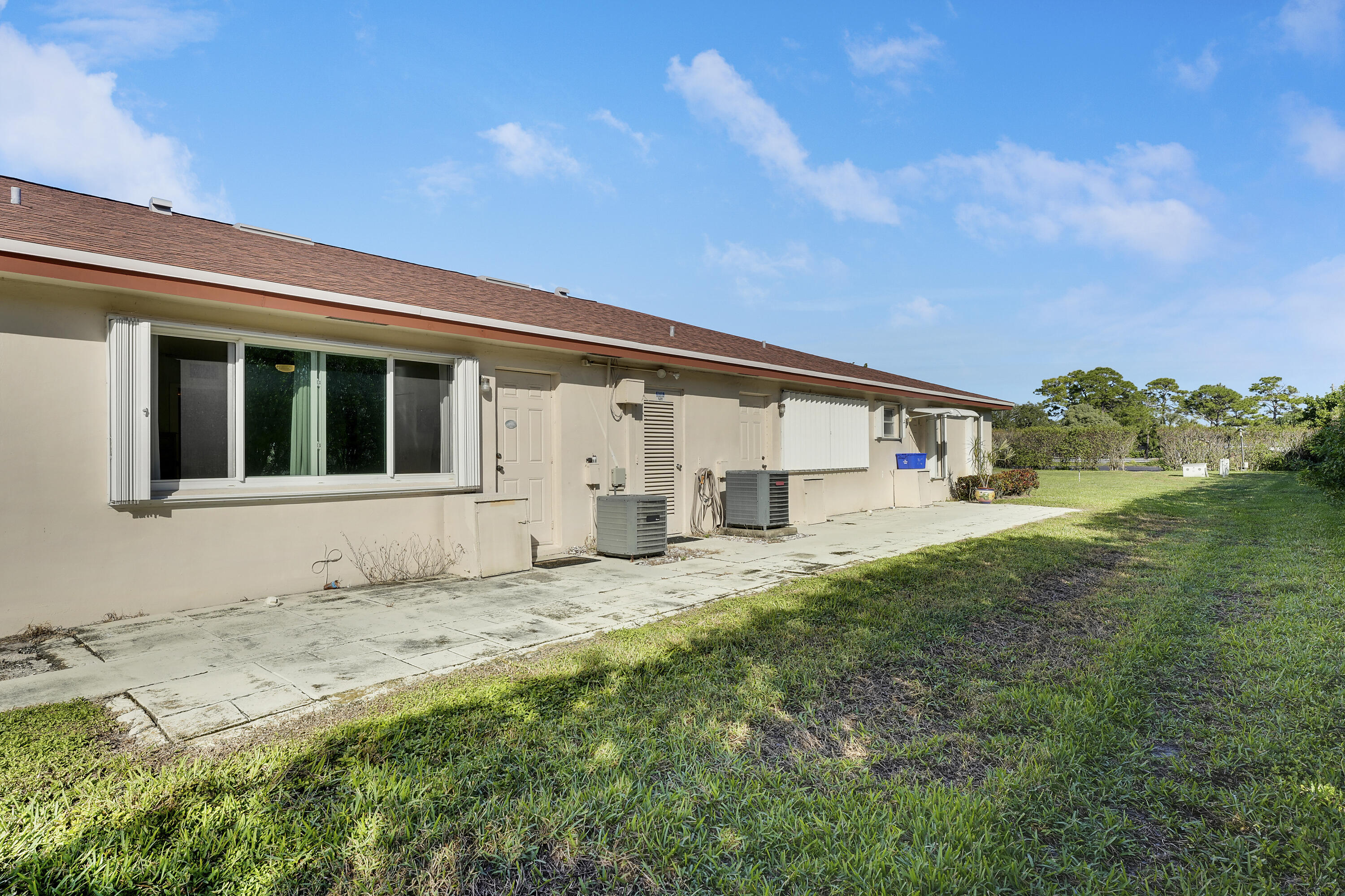 4515 Northwest 3rd Court, Unit C Delray Beach, FL 33445 - Photo 4 of 25 a house with garden in front of it
