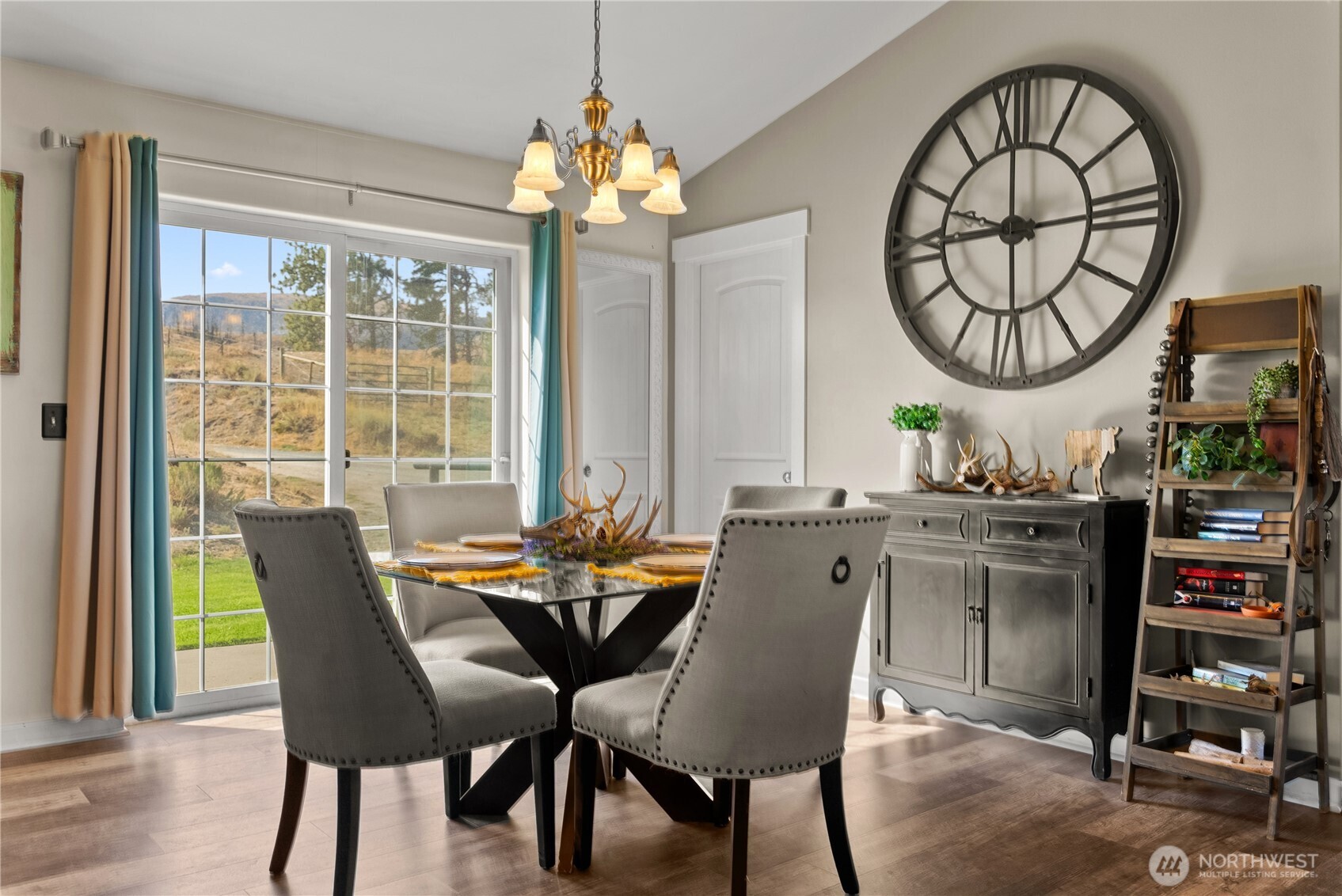 1486 North Star Road Malott, WA 98829 - Photo 15 of 40 a dining room with furniture a rug and a chandelier
