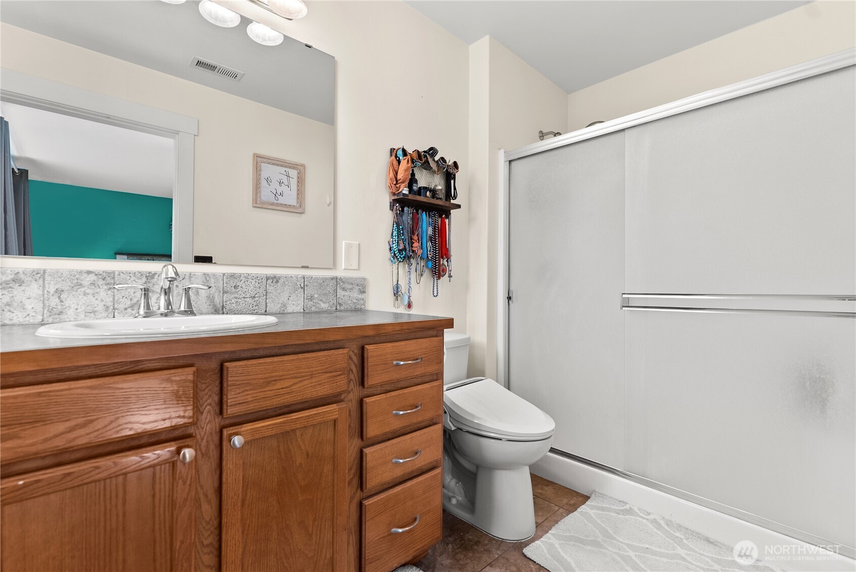 1486 North Star Road Malott, WA 98829 - Photo 25 of 40 a bathroom with a sink toilet and shower