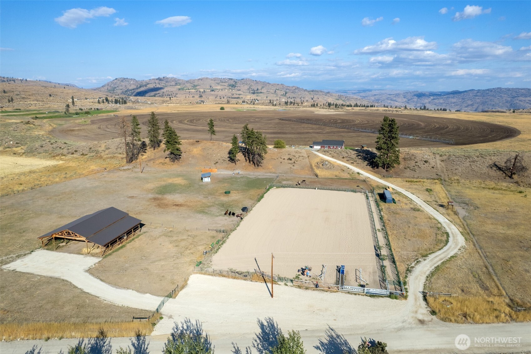 1486 North Star Road Malott, WA 98829 - Photo 7 of 40 a view of a swimming pool with a lake view