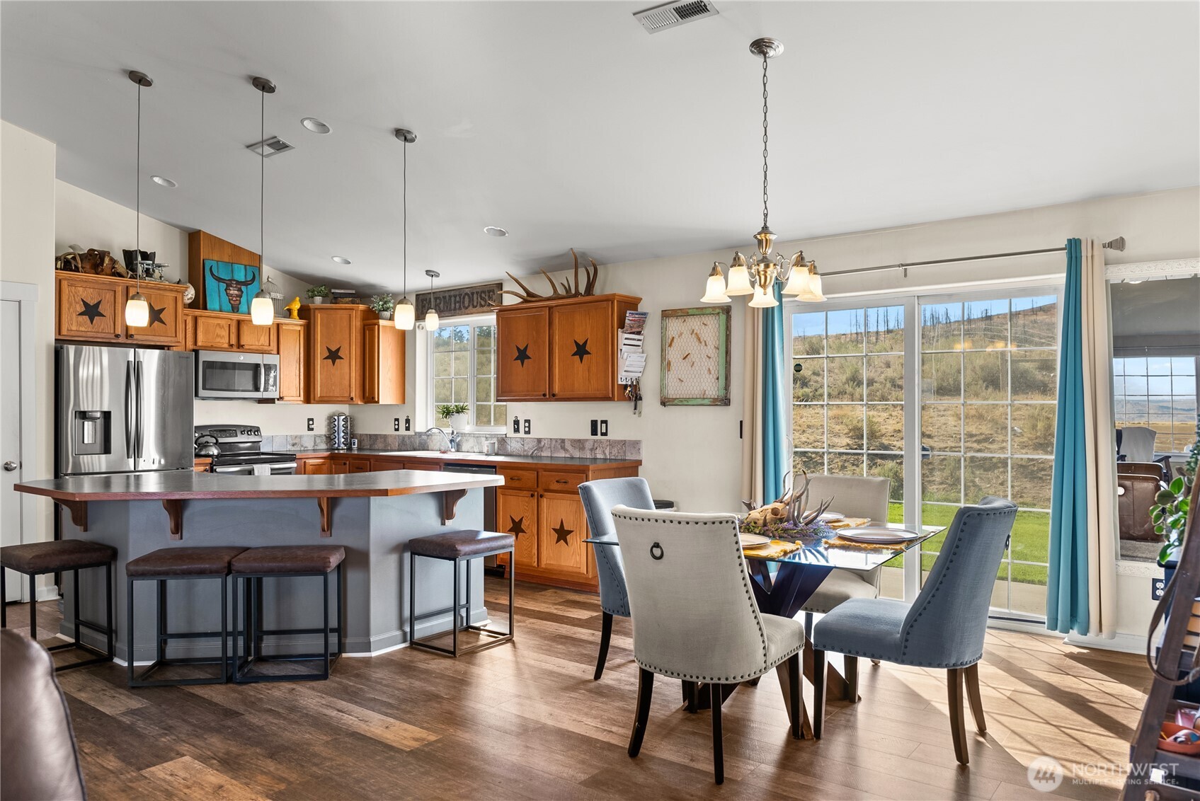1486 North Star Road Malott, WA 98829 - Photo 8 of 40 a dining table chairs and a chandelier