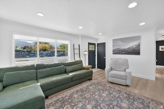 66 South 425 West Bountiful, UT 84010 - Photo 4 of 25 Spacious living area featuring light wood-finish flooring and ample recessed lighting
