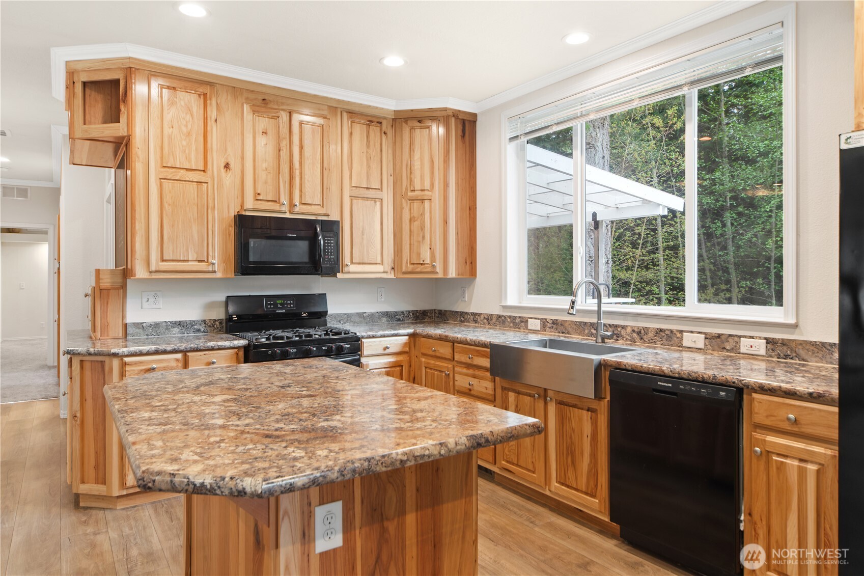 290 Werner Road Port Ludlow, WA 98365 - Photo 12 of 40 a kitchen with stainless steel appliances granite countertop a sink stove and microwave
