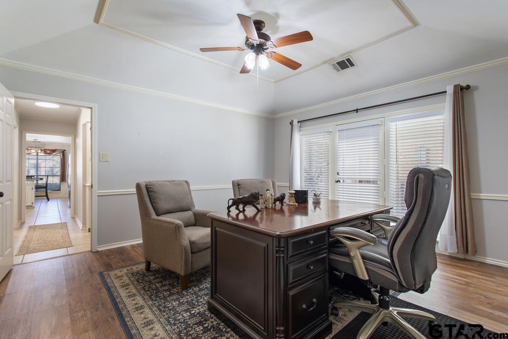 6005 Raleigh Drive Tyler, TX 75703 - Photo 24 of 35 a work room with furniture and wooden floor