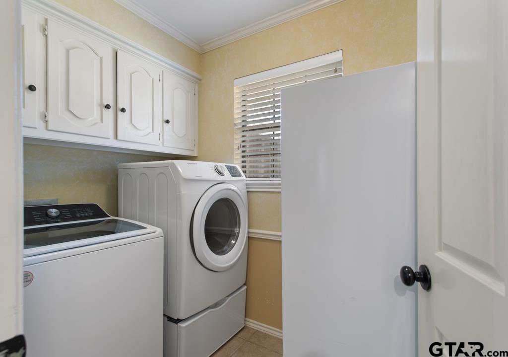 6005 Raleigh Drive Tyler, TX 75703 - Photo 29 of 35 a utility room with dryer and washer