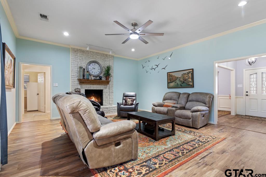 6005 Raleigh Drive Tyler, TX 75703 - Photo 3 of 35 a living room with furniture and a fireplace