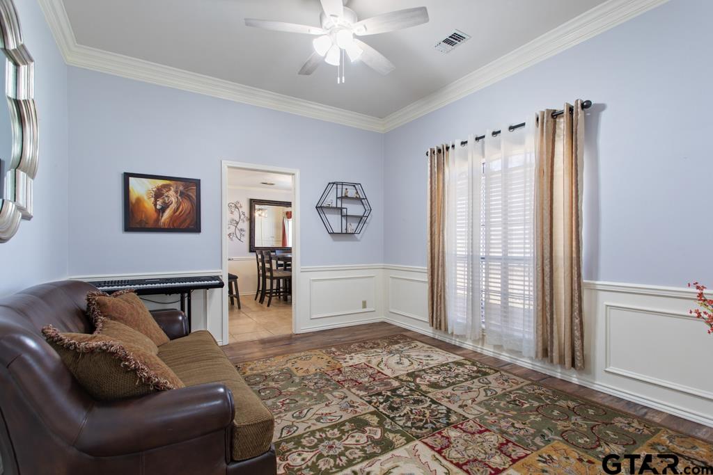 6005 Raleigh Drive Tyler, TX 75703 - Photo 5 of 35 a living room with furniture and a window