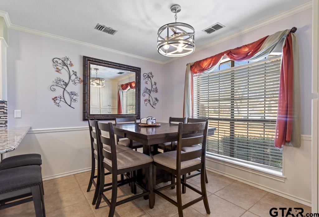 6005 Raleigh Drive Tyler, TX 75703 - Photo 10 of 35 a view of a dining room with furniture and window