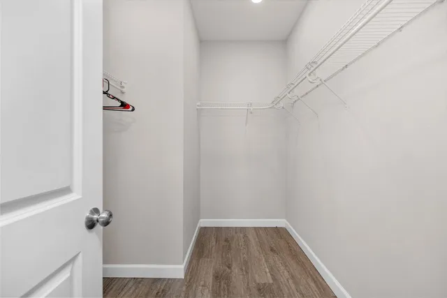 a bathroom with a granite countertop sink and shower