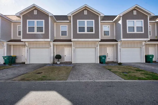 a front view of a house with yard