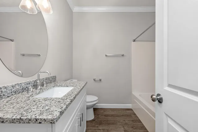 an empty room with a window and a ceiling fan