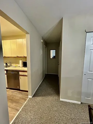 a view of a kitchen with a sink and dishwasher