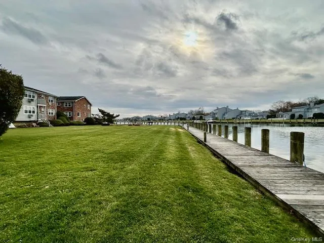 a view of a house with swimming pool and sitting area
