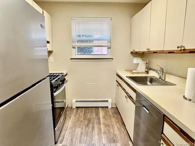 a hallway with a sink and a window