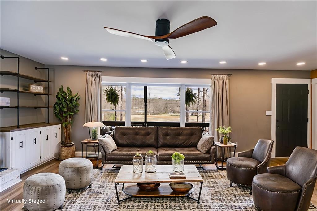 118 Raven Road Villa Rica, GA 30180 - Photo 12 of 59 a living room with furniture and a large window