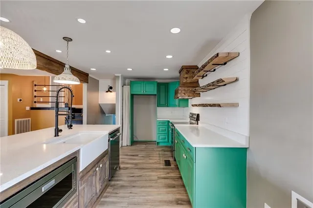 a kitchen with granite countertop a stove and a cabinets