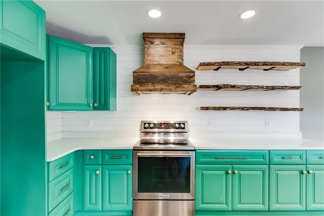 a view of an empty room with a window and a ceiling fan