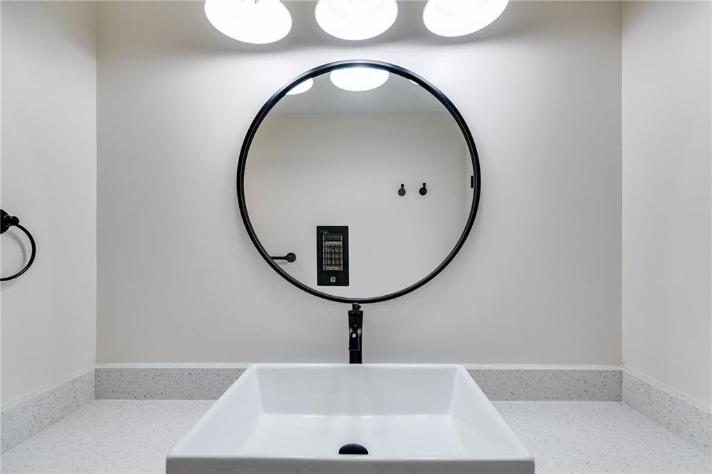 118 Raven Road Villa Rica, GA 30180 - Photo 29 of 59 a bathroom with a mirror and bathtub