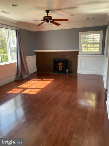 a kitchen with stainless steel appliances granite countertop a refrigerator and a stove