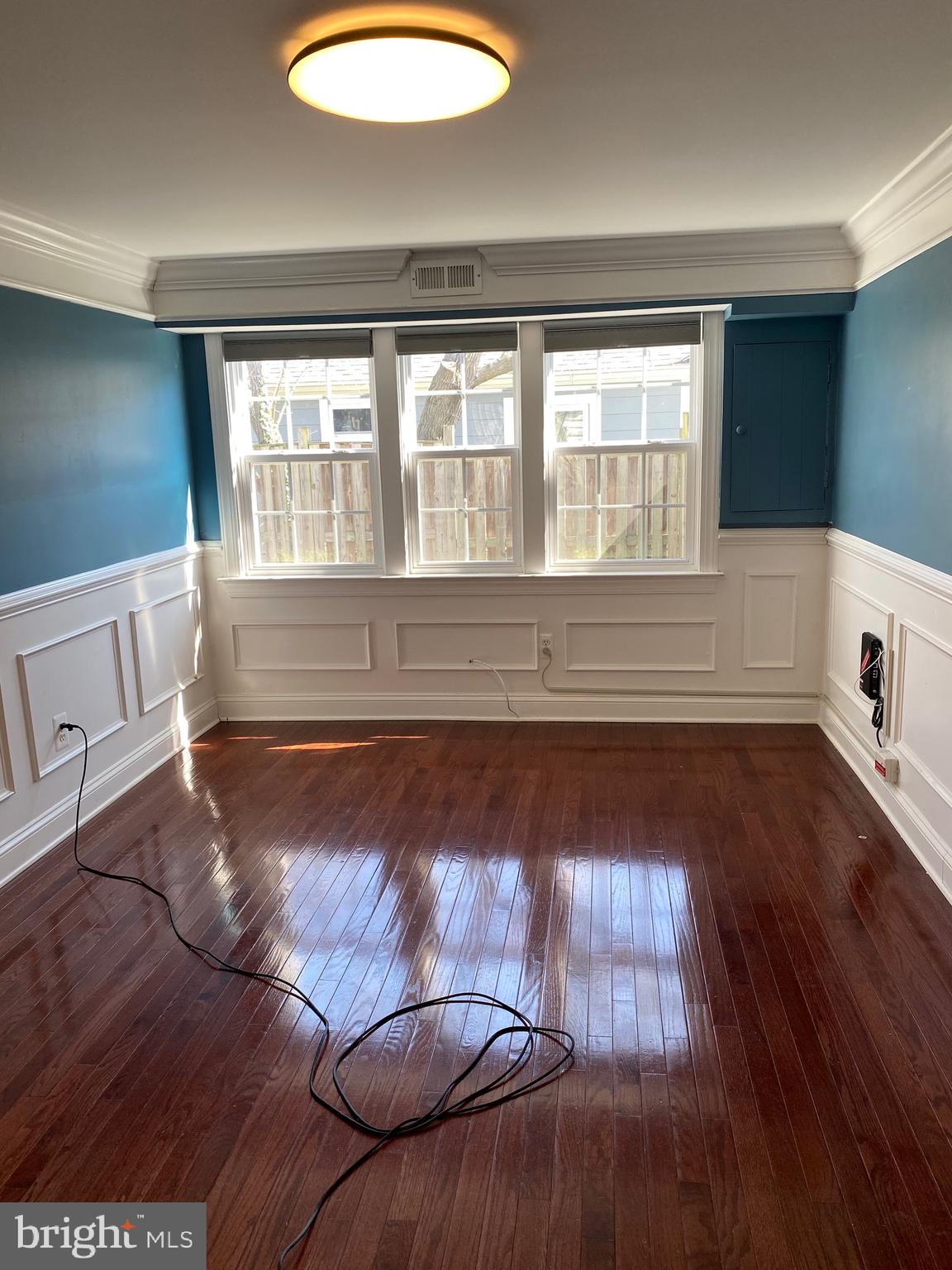 1403 Gleason Street Silver Spring, MD 20902 - Photo 25 of 34 a view of an empty room with wooden floor and a window