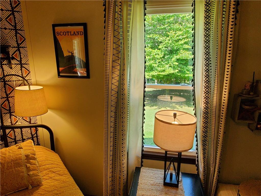 606 Keetor Road Talking Rock, GA 30175 - Photo 18 of 93 a bedroom with a bed and wooden floor