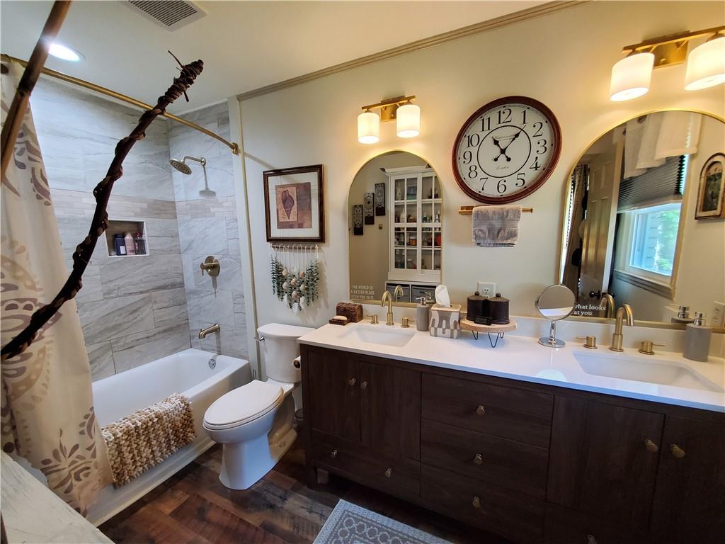606 Keetor Road Talking Rock, GA 30175 - Photo 19 of 93 a bathroom with a bathroom sink and a mirror