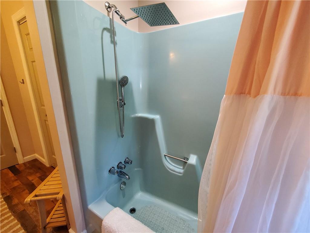 606 Keetor Road Talking Rock, GA 30175 - Photo 30 of 93 a bathroom with a tub and shower