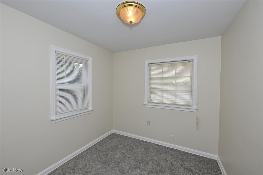 897 Reed Avenue Akron, OH 44306 - Photo 25 of 33 Carpeted spare room featuring a healthy amount of sunlight