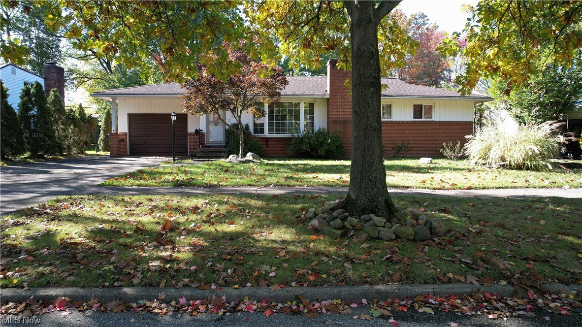 6676 Rochelle Boulevard Parma Heights, OH 44130 - Photo 3 of 21 Ranch-style home featuring a garage