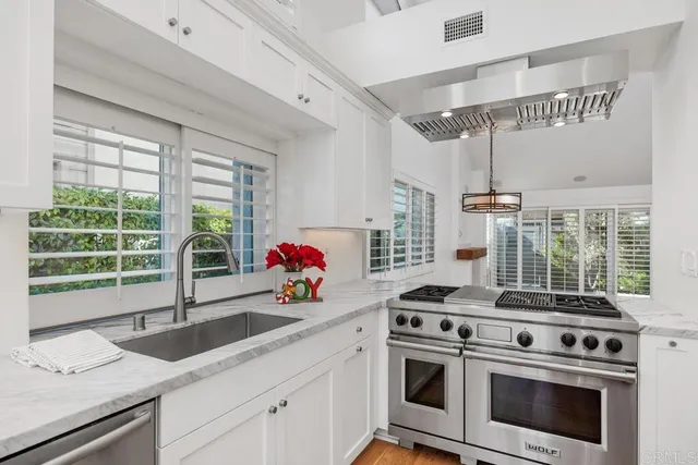 a kitchen with a stove and a sink