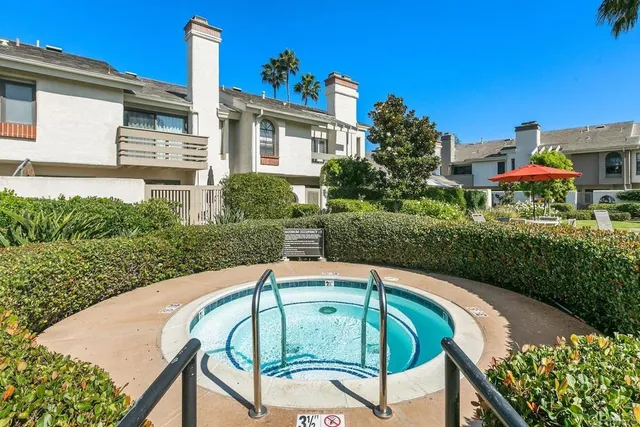 a view of a balcony with two chairs and a table