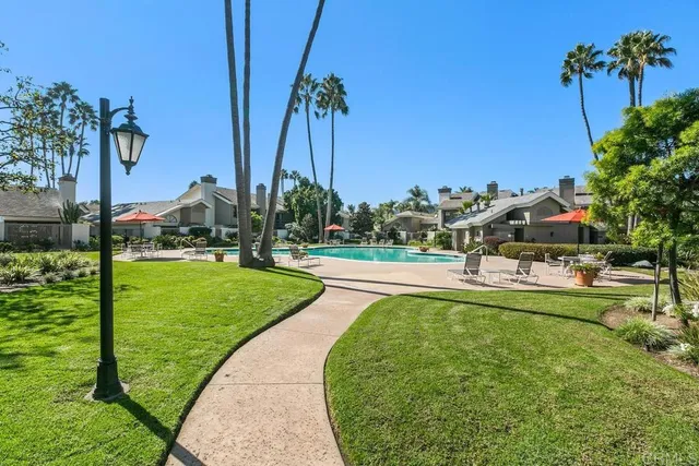 a view of a swimming pool and a yard