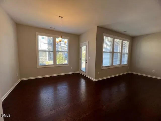 a spacious bathroom with a double vanity sink and mirror