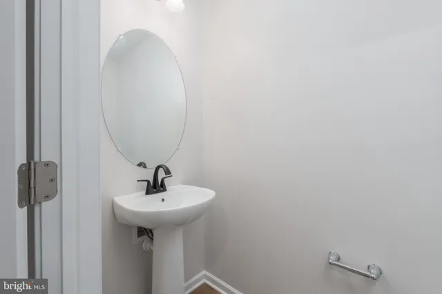 a bathroom with a sink and mirror