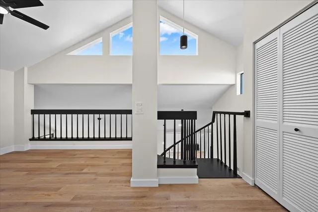 a view of a balcony with wooden floor and stairs