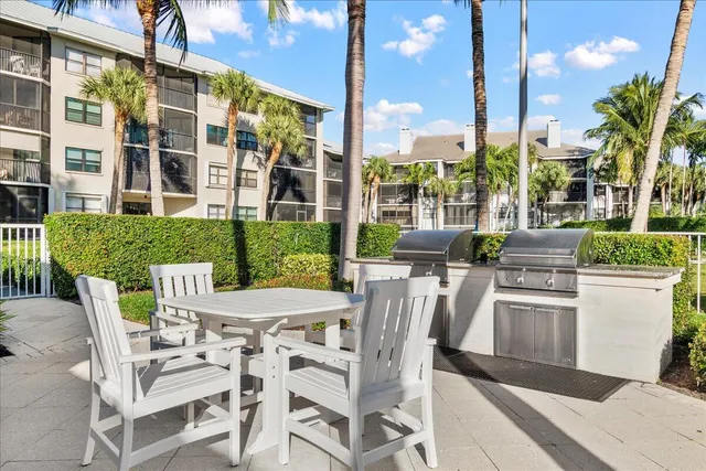 a table and chairs sitting in front of a building