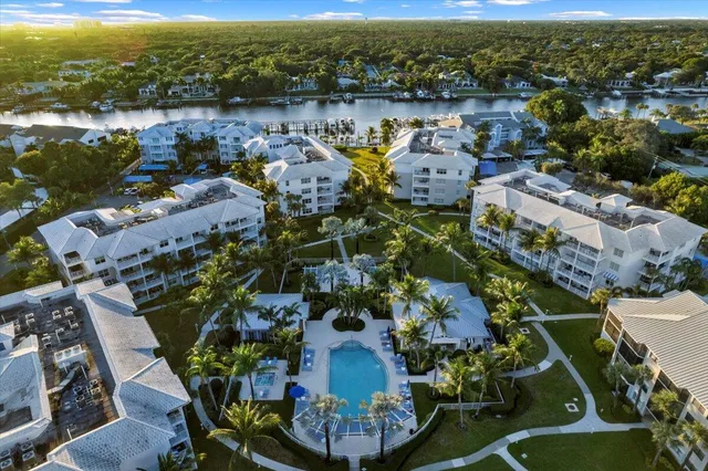 an aerial view of a house with a lake view