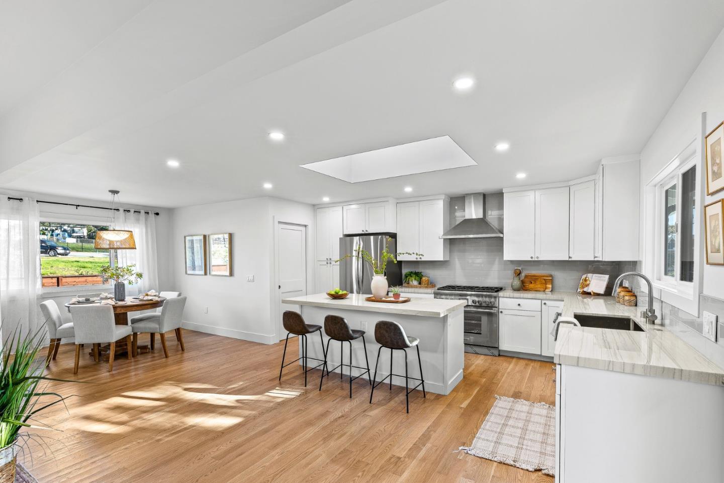 880 Pinehurst Drive Aptos, CA 95003 - Photo 11 of 25 a kitchen with a sink a stove a refrigerator cabinets and dining table