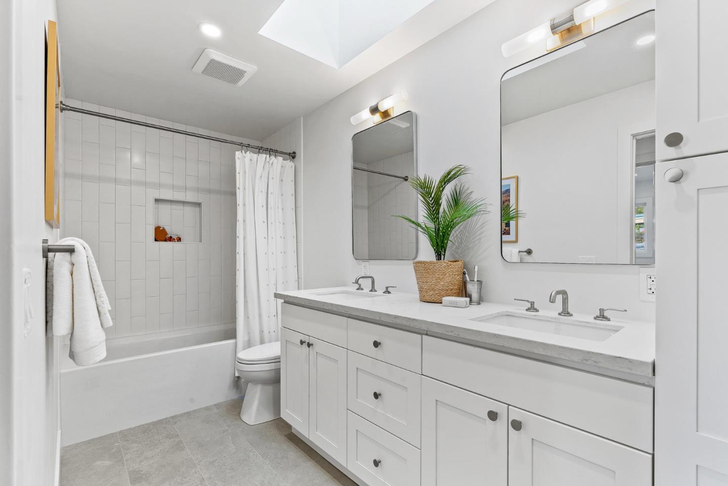 880 Pinehurst Drive Aptos, CA 95003 - Photo 15 of 25 a bathroom with a double vanity sink toilet and shower