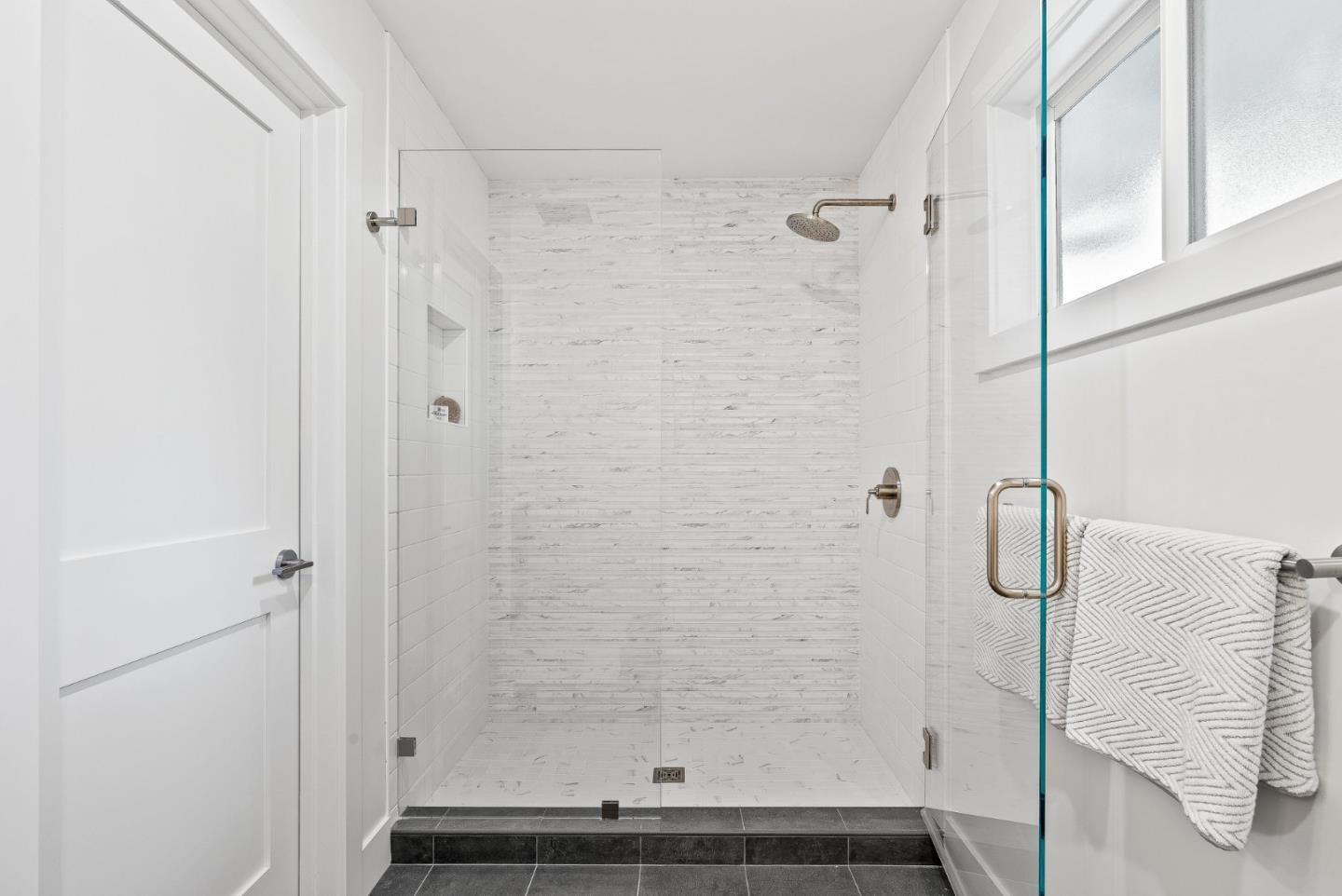 880 Pinehurst Drive Aptos, CA 95003 - Photo 16 of 25 a bathroom with a glass shower door